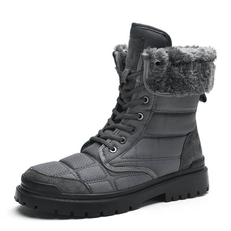 a pair of gray boots with fur lined inside