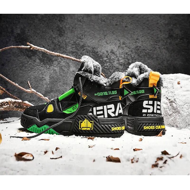 a pair of black and green sneakers sitting on top of snow covered ground