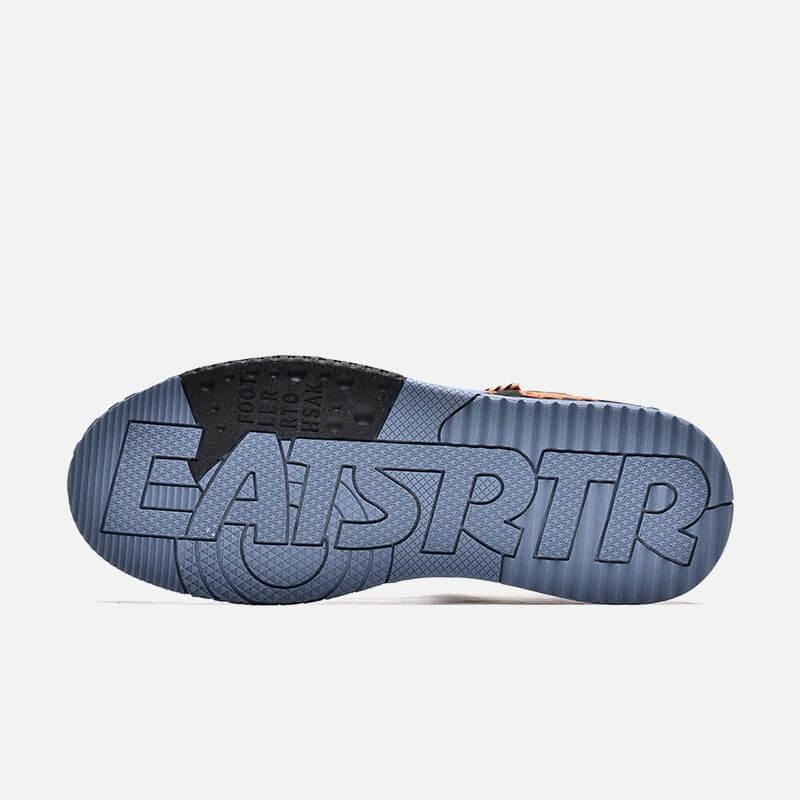 a pair of sneakers with the word east on them