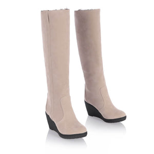 a pair of women's boots on a white background