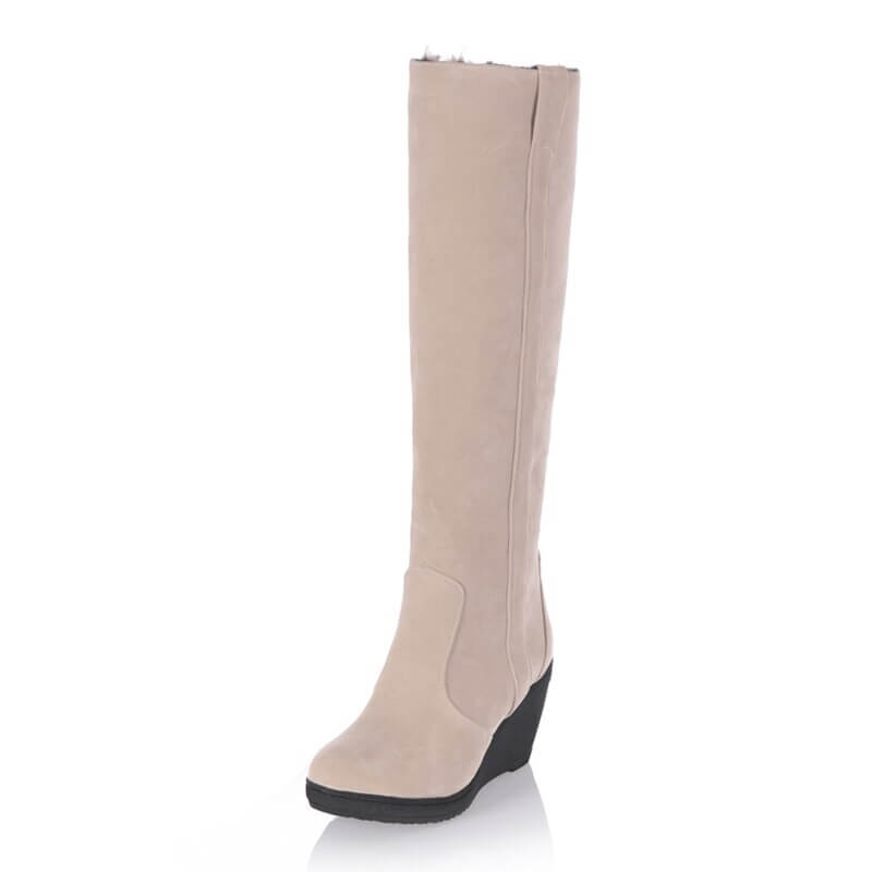 a women's boot with a wedged heel