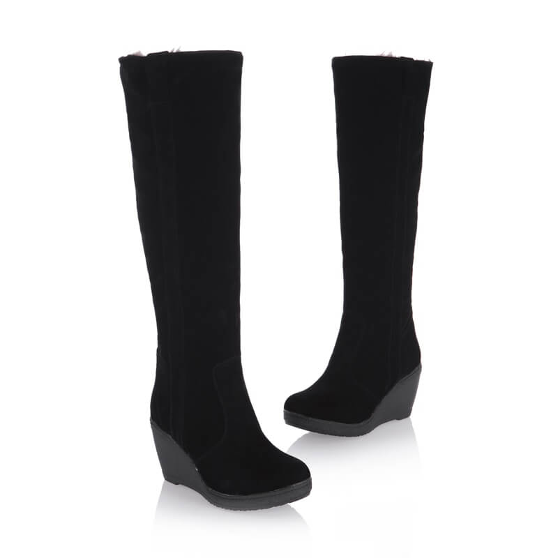 a pair of black boots on a white background