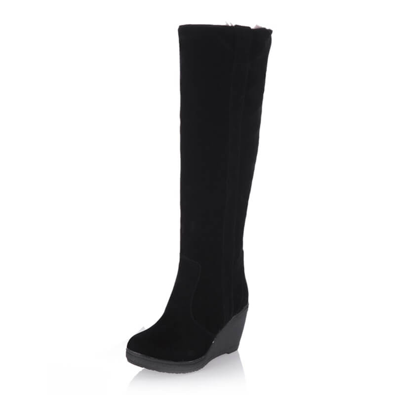 a tall black boot with a wedge heel