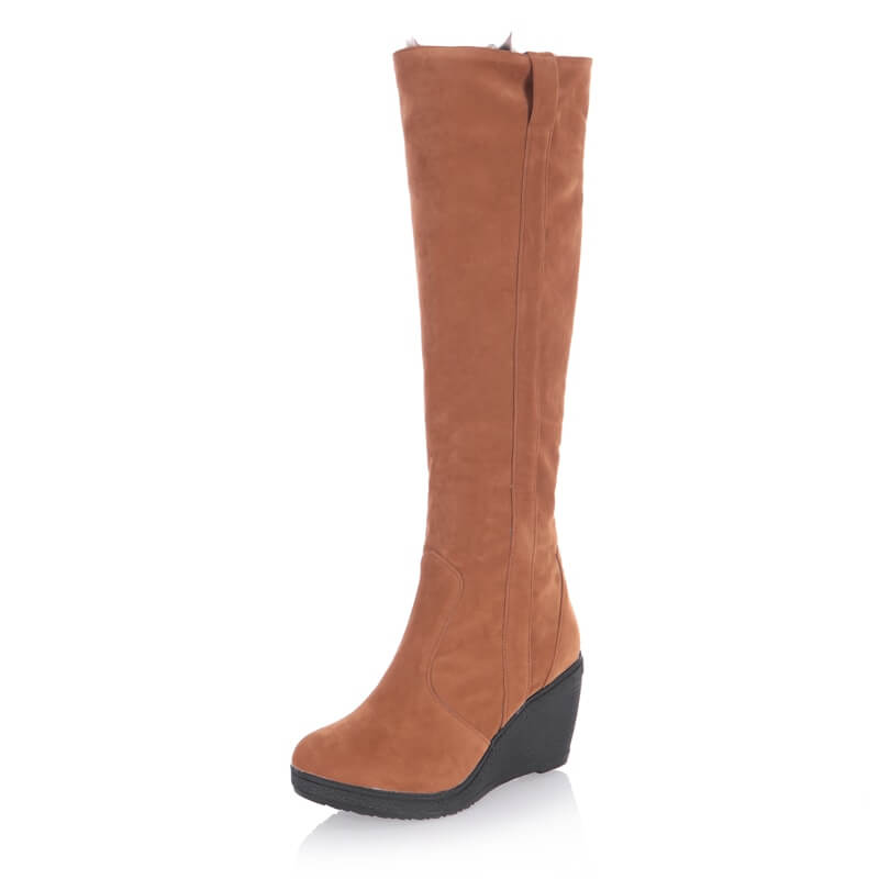 a tall brown boot with a wedged heel